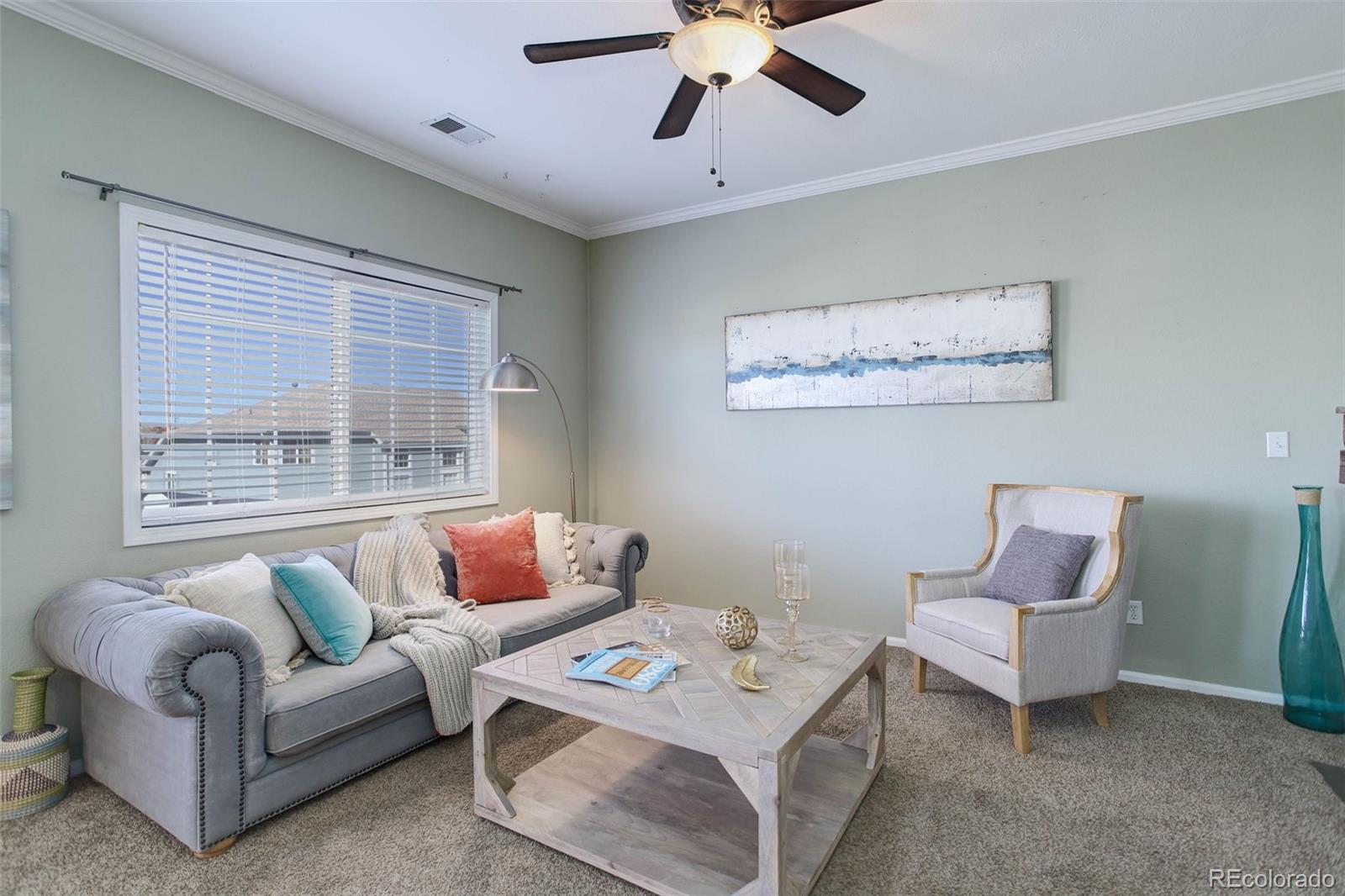 2471 South Andes Circle Aurora, CO 80013 - Photo 14 of 35 a living room with furniture and a window
