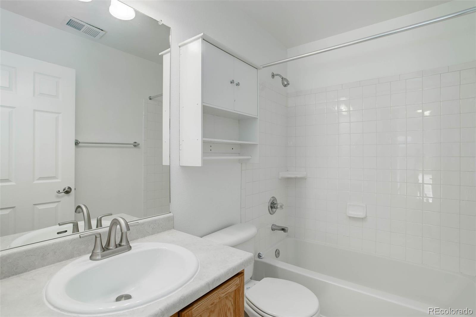2471 South Andes Circle Aurora, CO 80013 - Photo 24 of 35 a bathroom with a sink toilet and shower