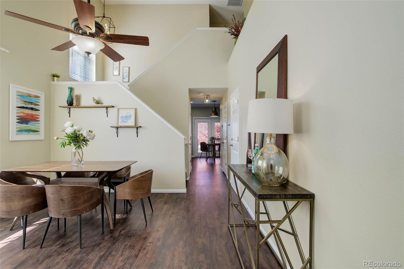 2471 South Andes Circle Aurora, CO 80013 - Photo 3 of 35 a dining room with furniture and wooden floor