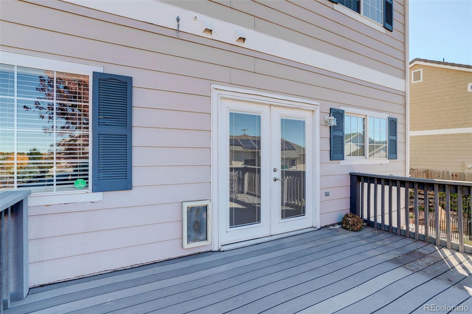 2471 South Andes Circle Aurora, CO 80013 - Photo 34 of 35 a view of a deck with wooden floor and fence