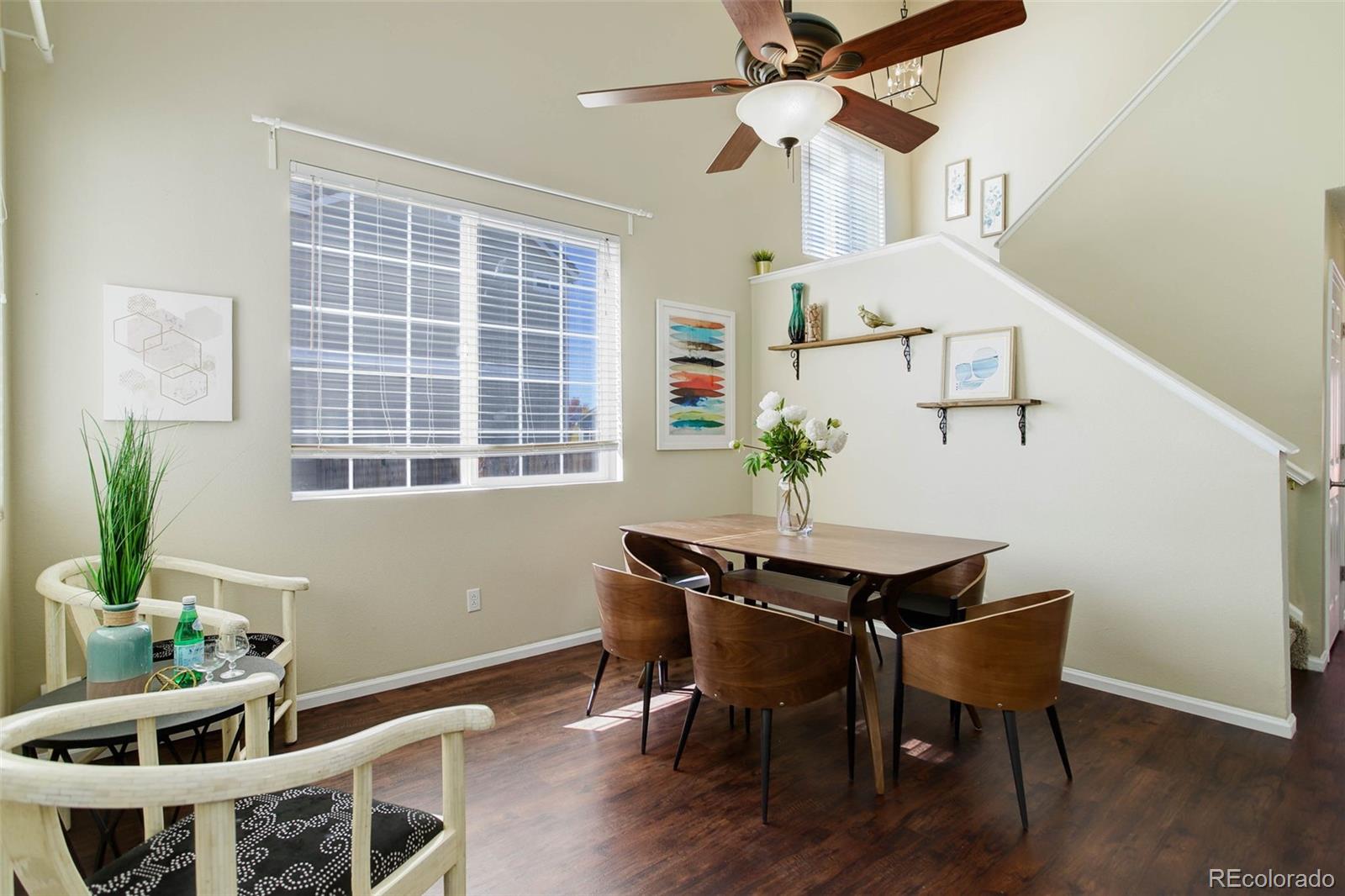 2471 South Andes Circle Aurora, CO 80013 - Photo 4 of 35 a view of a dining room with furniture window and wooden floor