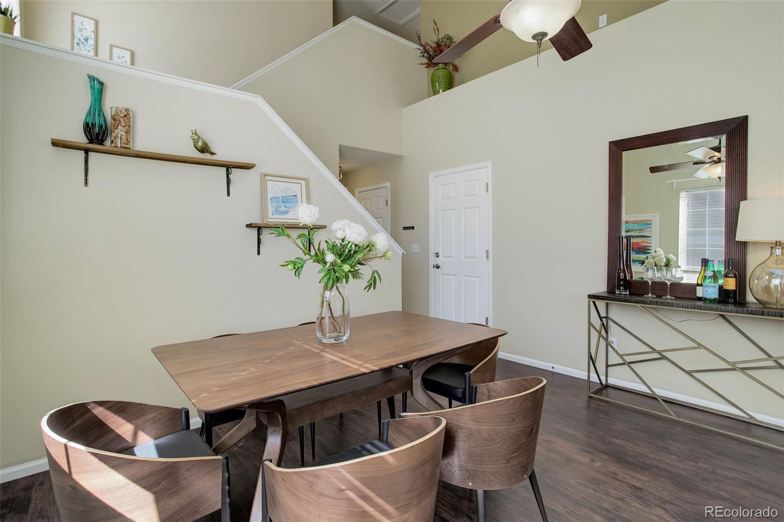 2471 South Andes Circle Aurora, CO 80013 - Photo 5 of 35 a view of a dining room with furniture and wooden floor