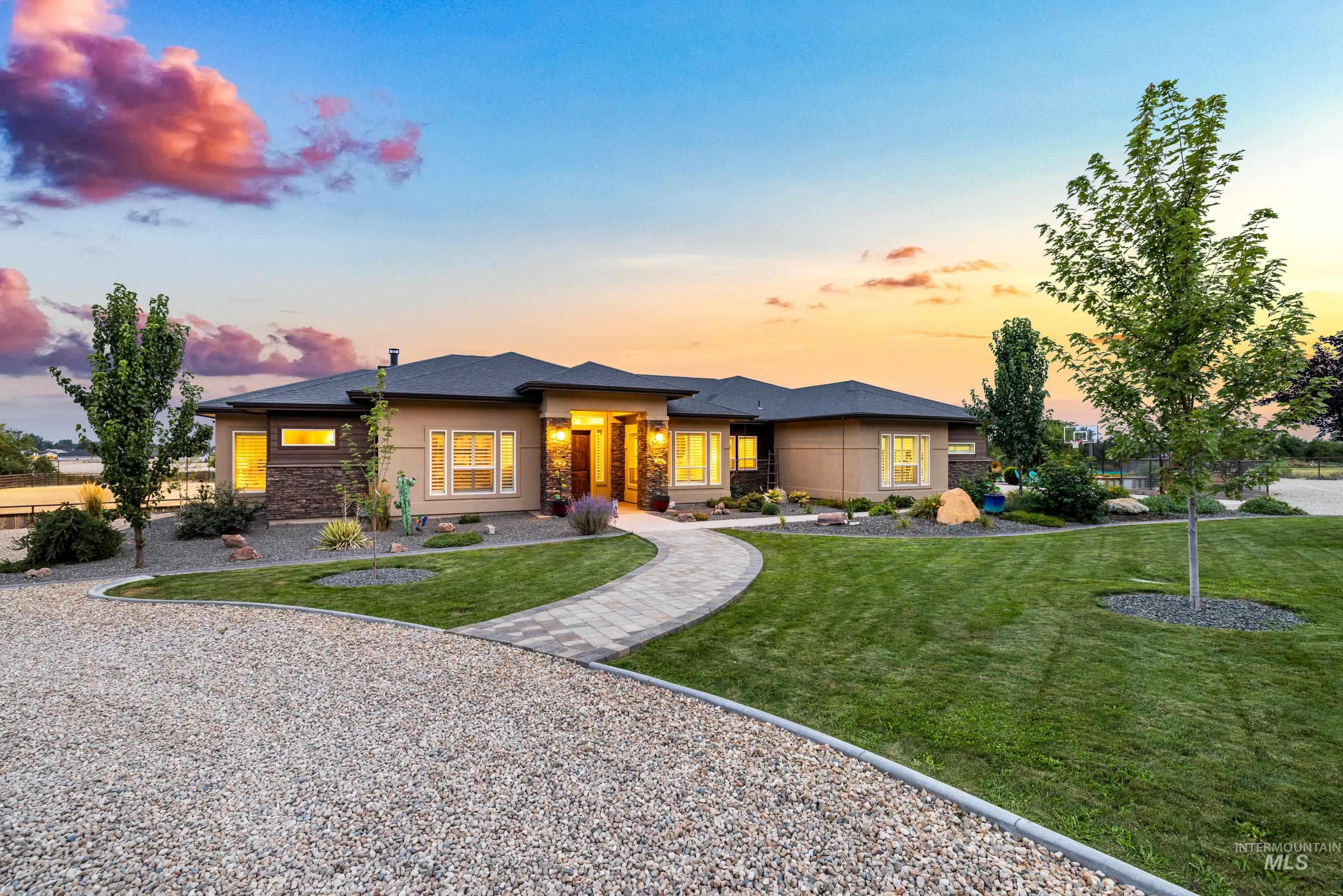 9819 Foothill Road Middleton, ID 83644 - Photo 1 of 50 Prairie-style home featuring stone siding and a yard