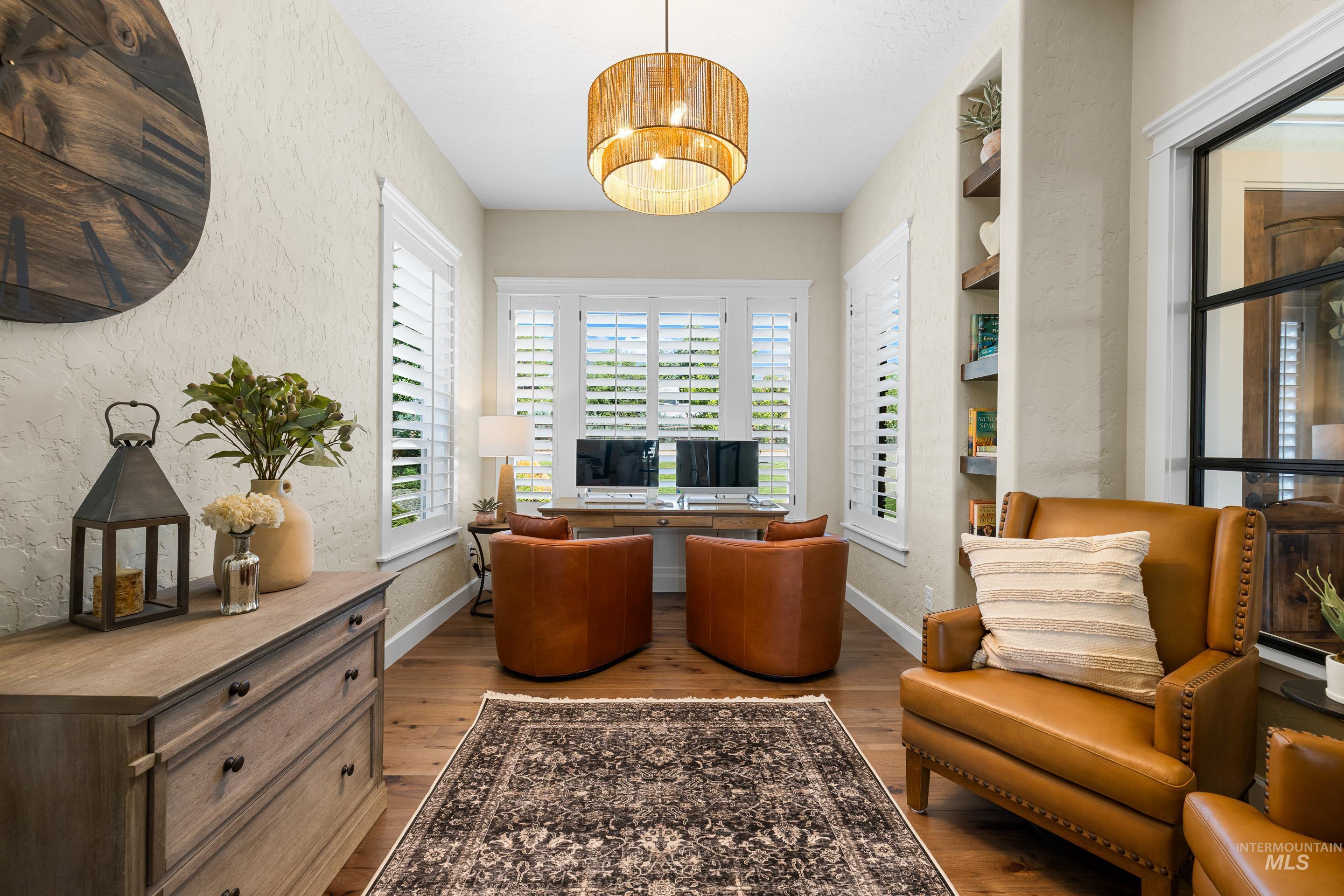 9819 Foothill Road Middleton, ID 83644 - Photo 13 of 50 Living area featuring wood finished floors and a textured wall