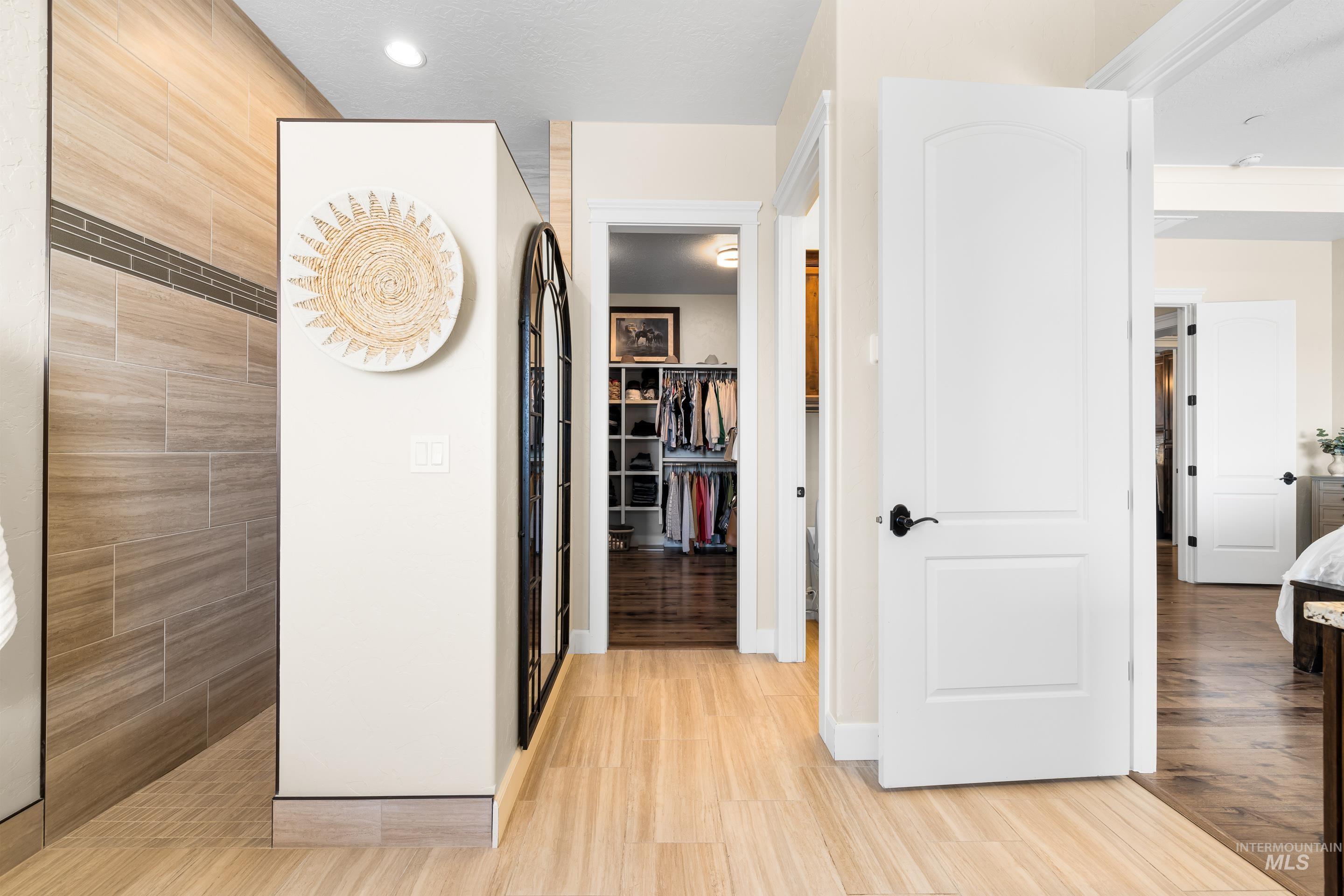 9819 Foothill Road Middleton, ID 83644 - Photo 27 of 50 Corridor with light wood finished floors and baseboards