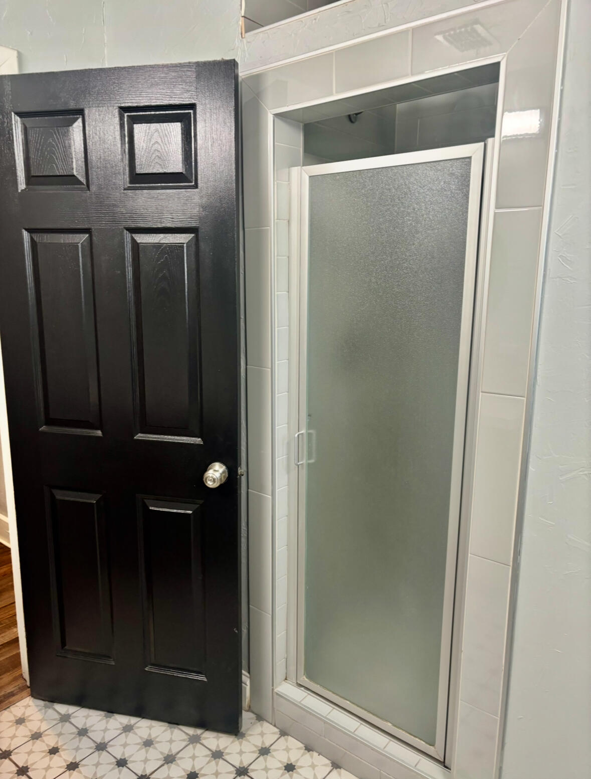 2224 36th Street Lubbock, TX 79412 - Photo 16 of 33 a bathroom with a glass shower door