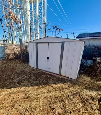 a view of a backyard of the house