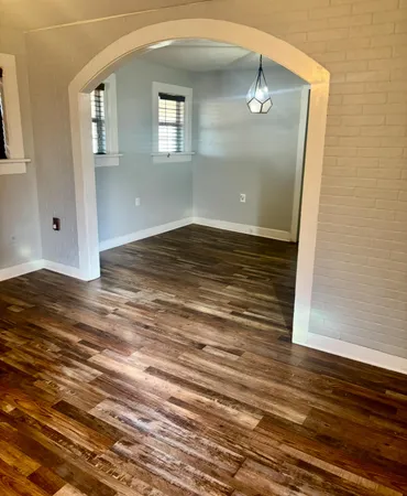 a view of a livingroom with wooden floor