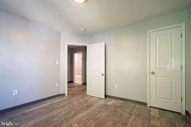 an empty room with wooden floor