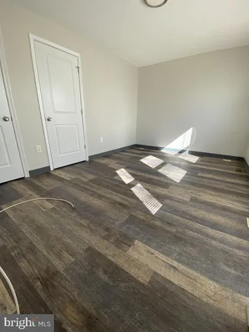 a view of a livingroom with wooden floor