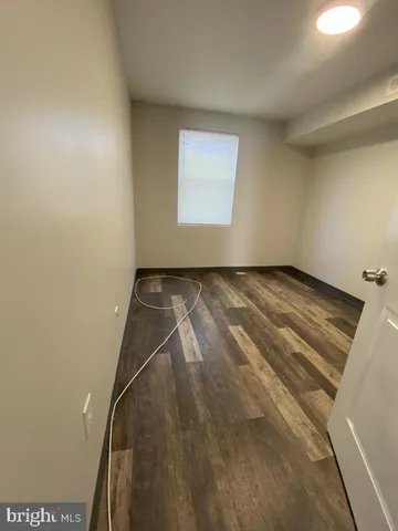a bathroom with a toilet and a bath tub