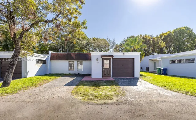 a view of backyard with large trees