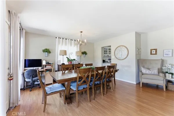 a large kitchen with stainless steel appliances granite countertop a stove a sink and a microwave