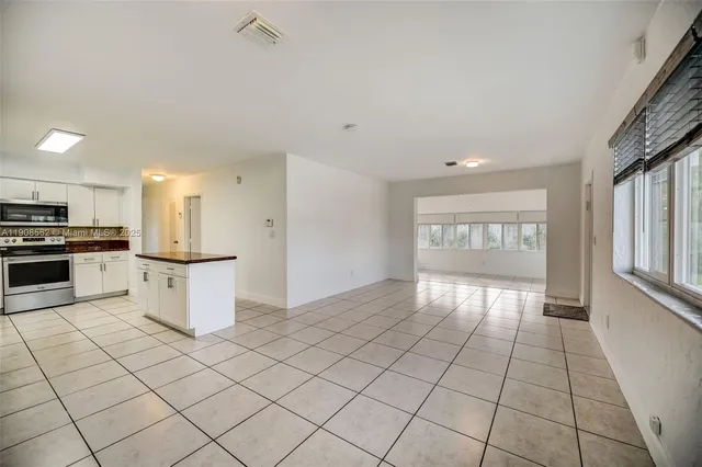 a view of an empty room and window