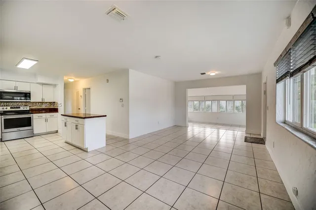 a view of an empty room and window