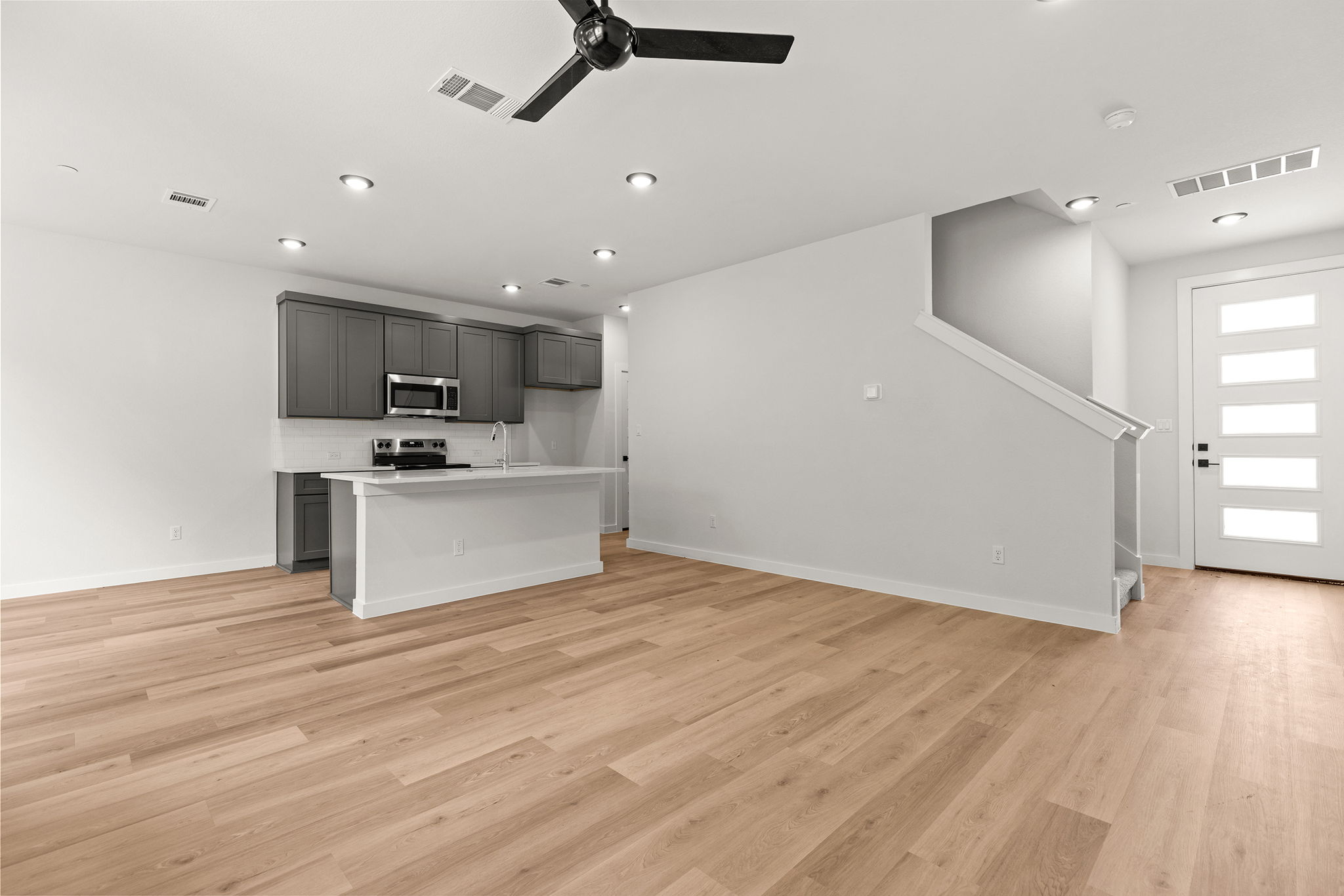 2600 Gattis School Road, Unit 1002 Round Rock, TX 78664 - Photo 10 of 40 An open concept design seamlessly connects the living area to a well-appointed kitchen.