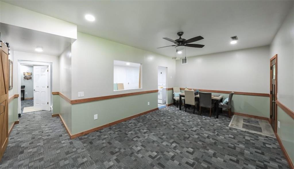 6945 John Rivers Road Fairburn, GA 30213 - Photo 13 of 65 a living room with furniture