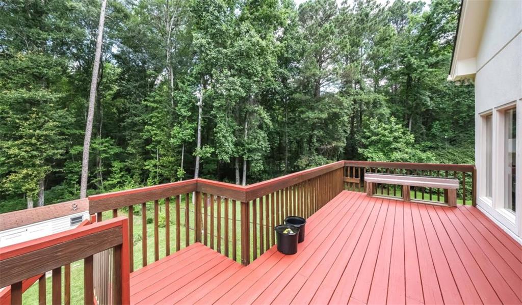 6945 John Rivers Road Fairburn, GA 30213 - Photo 21 of 65 a view of balcony with deck and trees