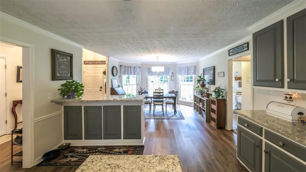 6945 John Rivers Road Fairburn, GA 30213 - Photo 30 of 65 a view of a living room and dining room