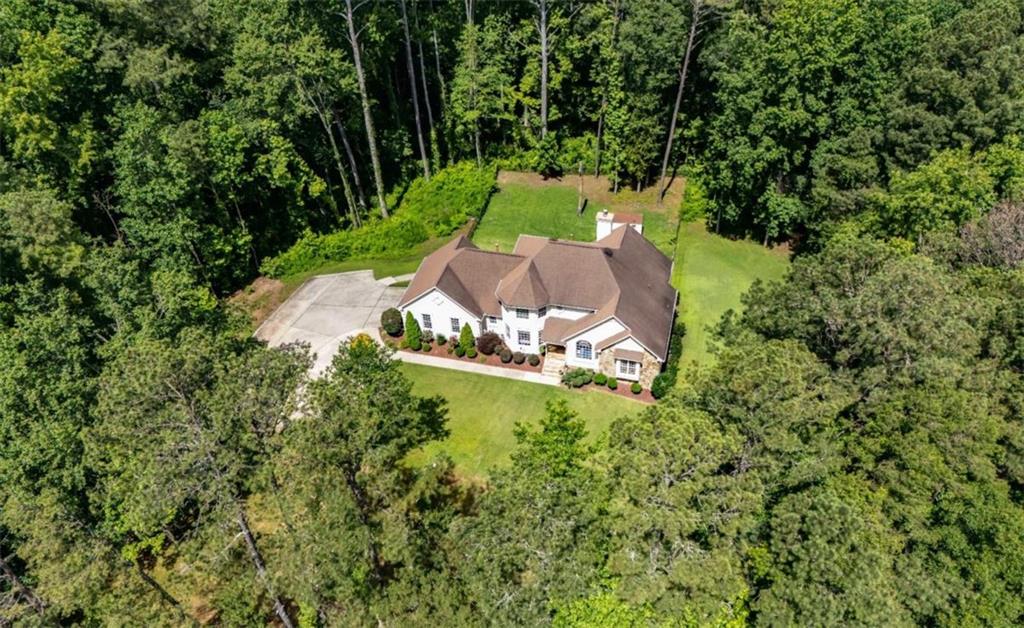 6945 John Rivers Road Fairburn, GA 30213 - Photo 3 of 65 an aerial view of a house with a yard basket ball court and outdoor seating