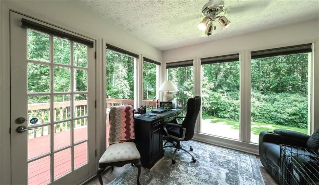 6945 John Rivers Road Fairburn, GA 30213 - Photo 41 of 65 a view of a dining room with furniture window and outside view