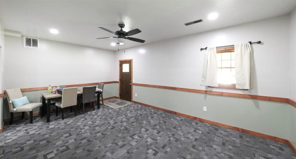 6945 John Rivers Road Fairburn, GA 30213 - Photo 51 of 65 a living room with furniture and a window