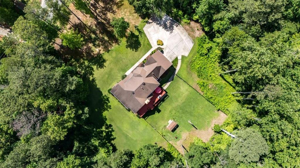 6945 John Rivers Road Fairburn, GA 30213 - Photo 6 of 65 an aerial view of residential house with outdoor space and trees all around