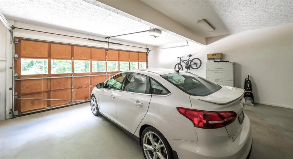 6945 John Rivers Road Fairburn, GA 30213 - Photo 61 of 65 a bathroom with a sink and mirror with window