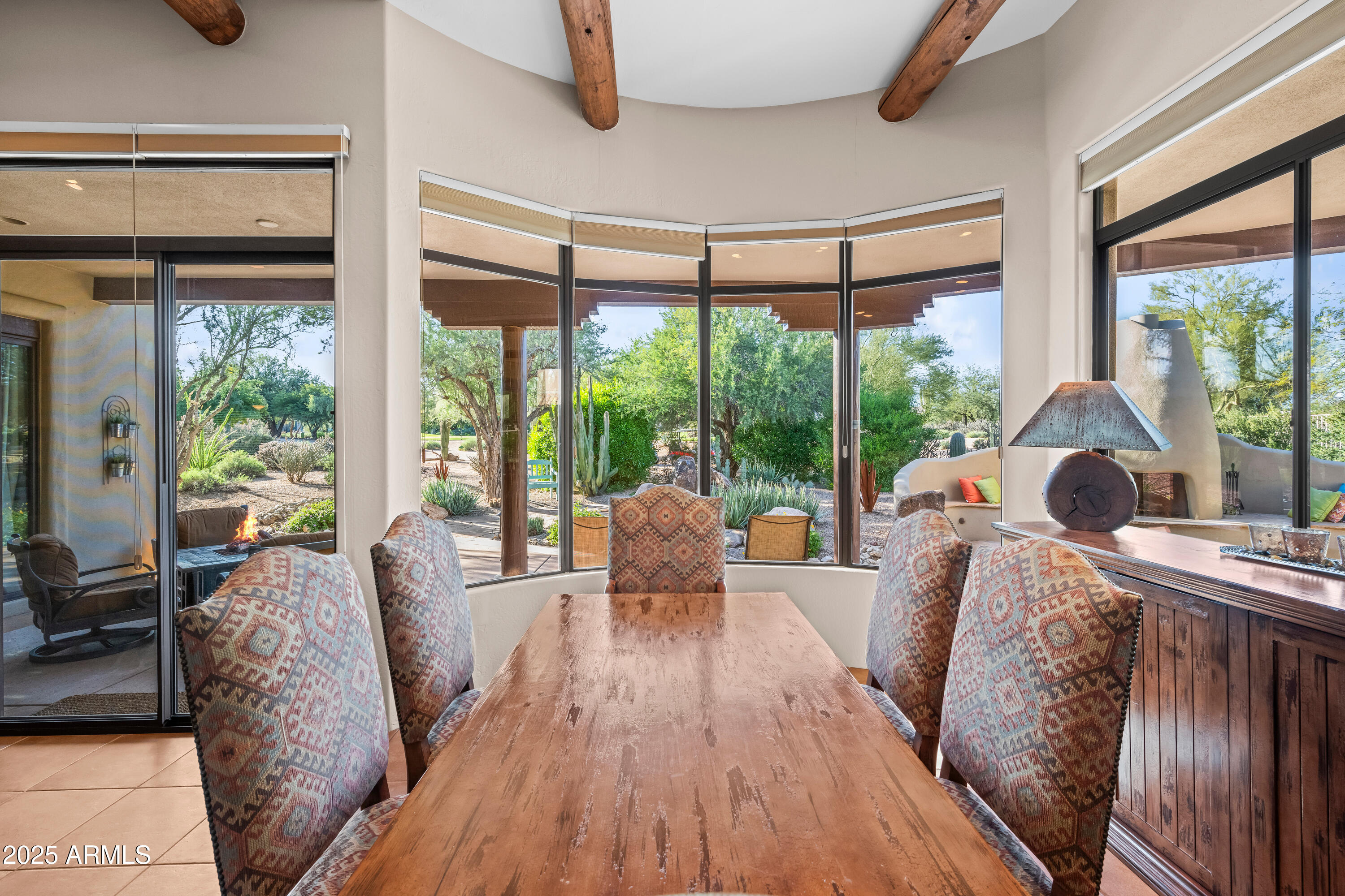 26708 North Aguila Road Rio Verde, AZ 85263 - Photo 11 of 46 a living room with furniture and a large window