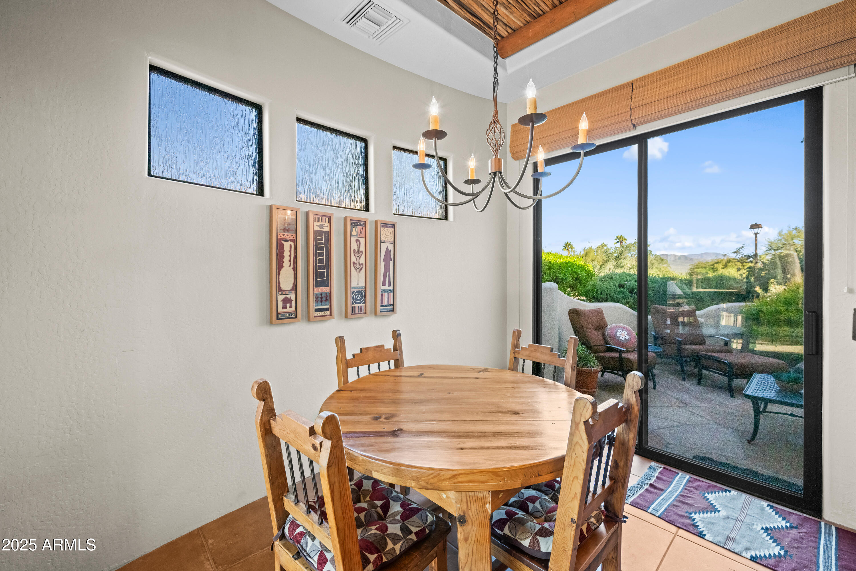 26708 North Aguila Road Rio Verde, AZ 85263 - Photo 16 of 46 a view of a dining room with furniture window and wooden floor