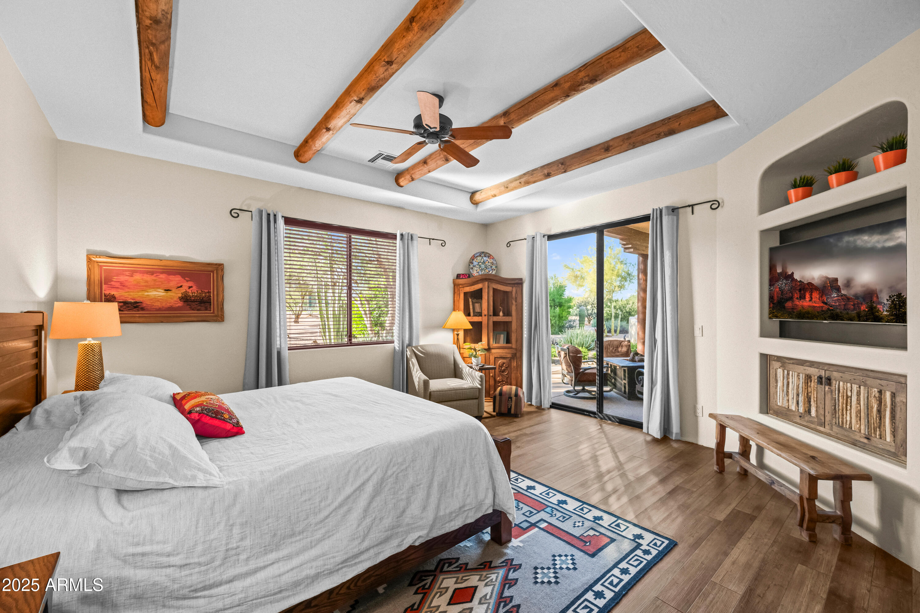 26708 North Aguila Road Rio Verde, AZ 85263 - Photo 21 of 46 a bed sitting in a bedroom next to a window