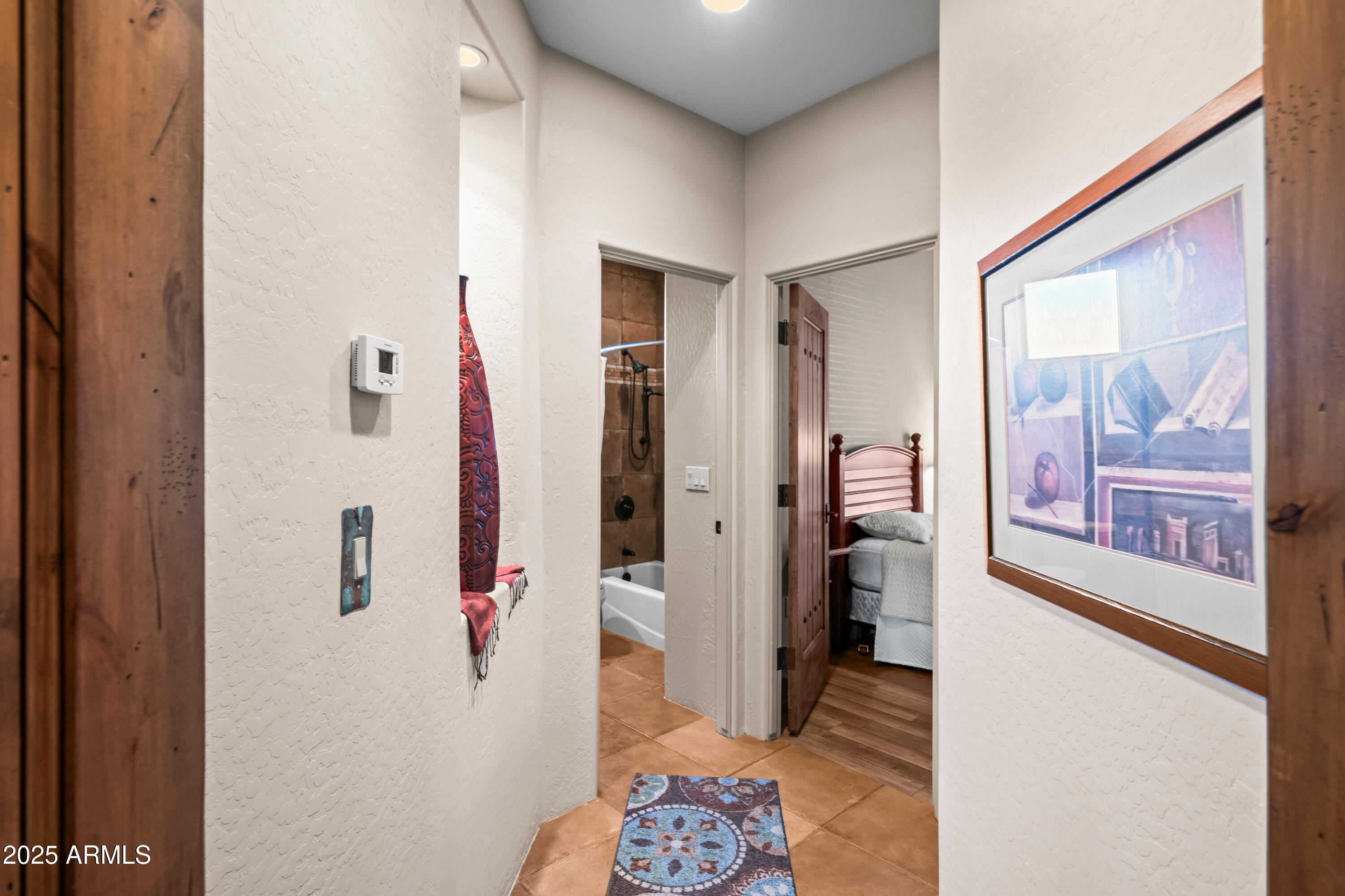 26708 North Aguila Road Rio Verde, AZ 85263 - Photo 27 of 46 a view of a hallway with wooden floor and staircase