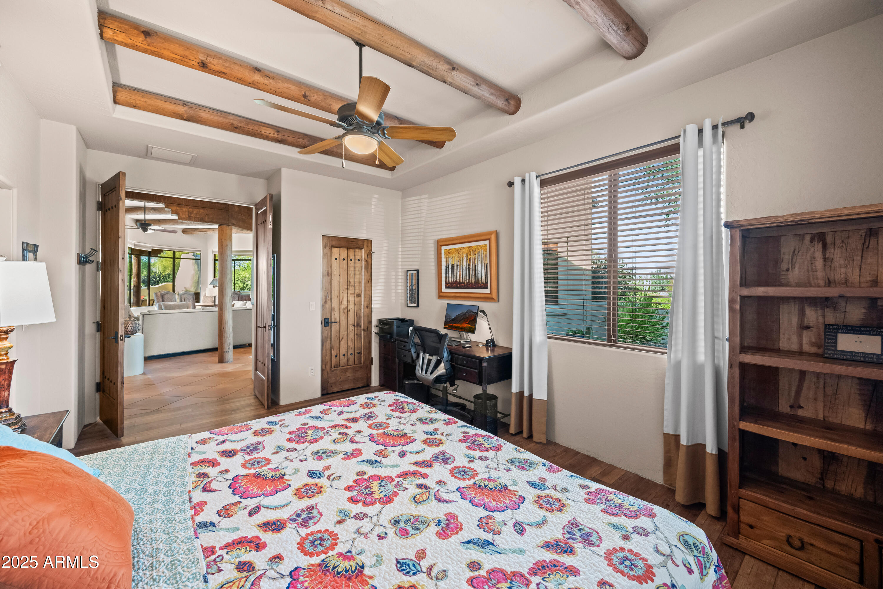 26708 North Aguila Road Rio Verde, AZ 85263 - Photo 29 of 46 a bedroom with a bed dresser and a window