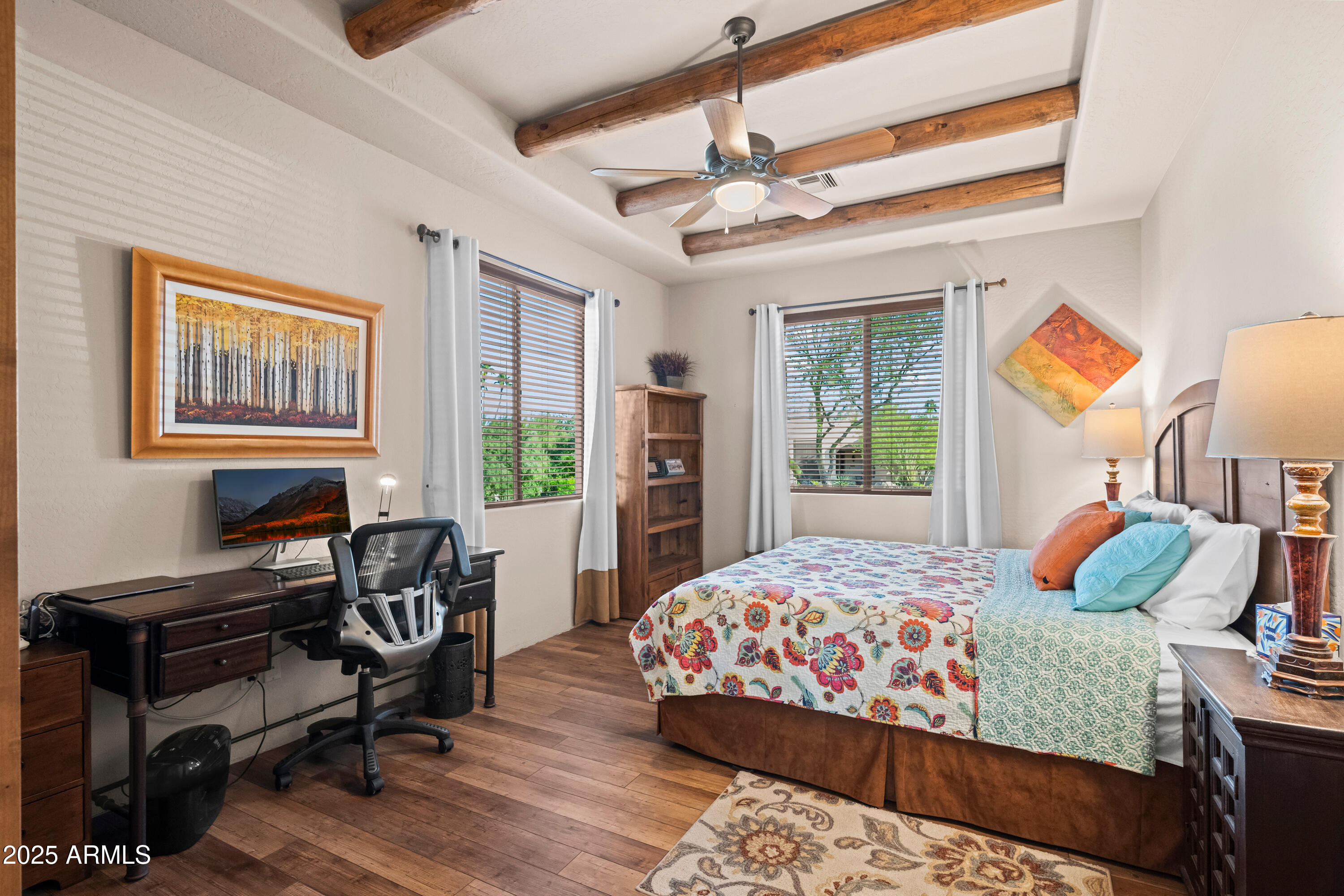 26708 North Aguila Road Rio Verde, AZ 85263 - Photo 30 of 46 a bedroom with a bed and a window