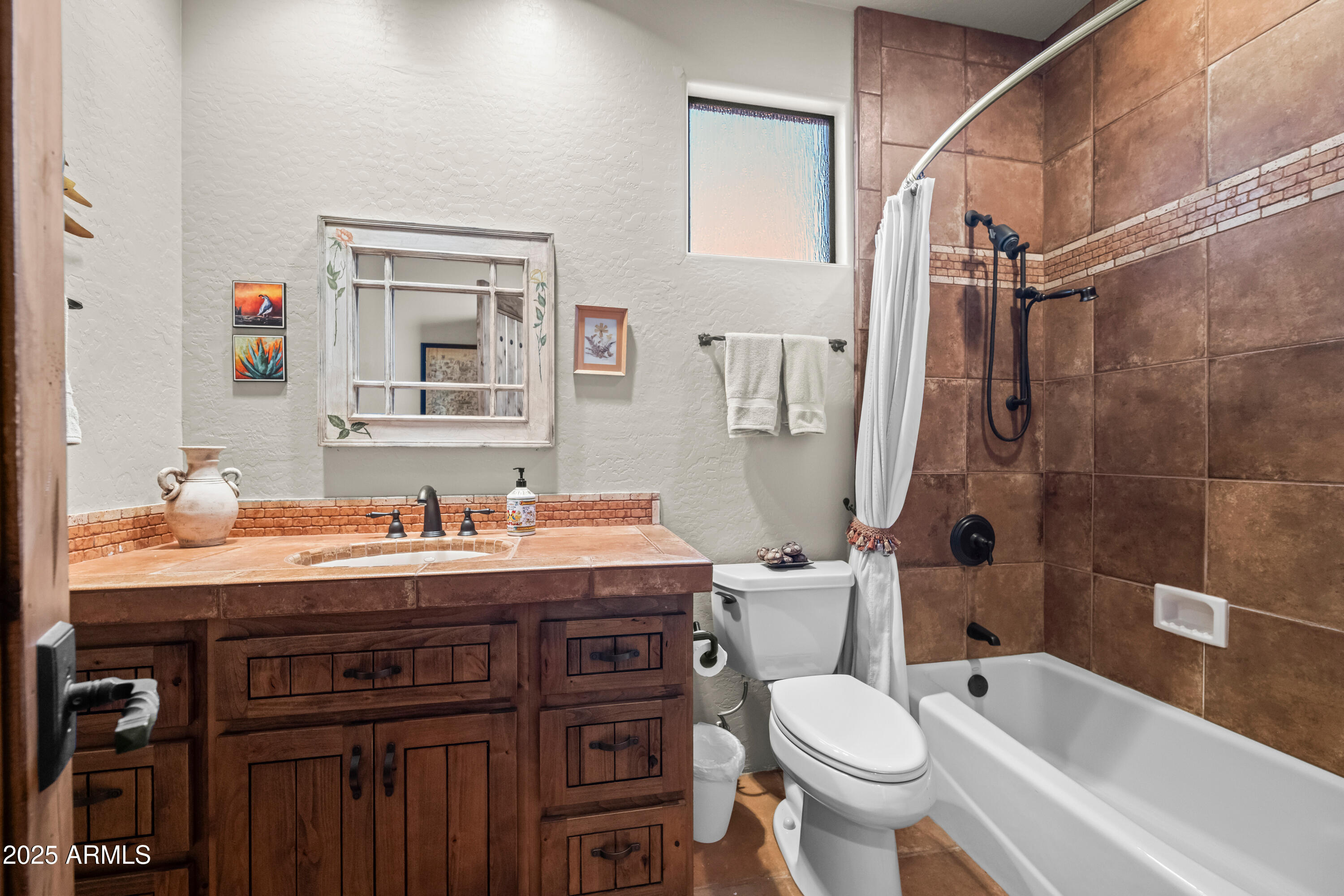 26708 North Aguila Road Rio Verde, AZ 85263 - Photo 31 of 46 a bathroom with a granite countertop toilet sink and mirror