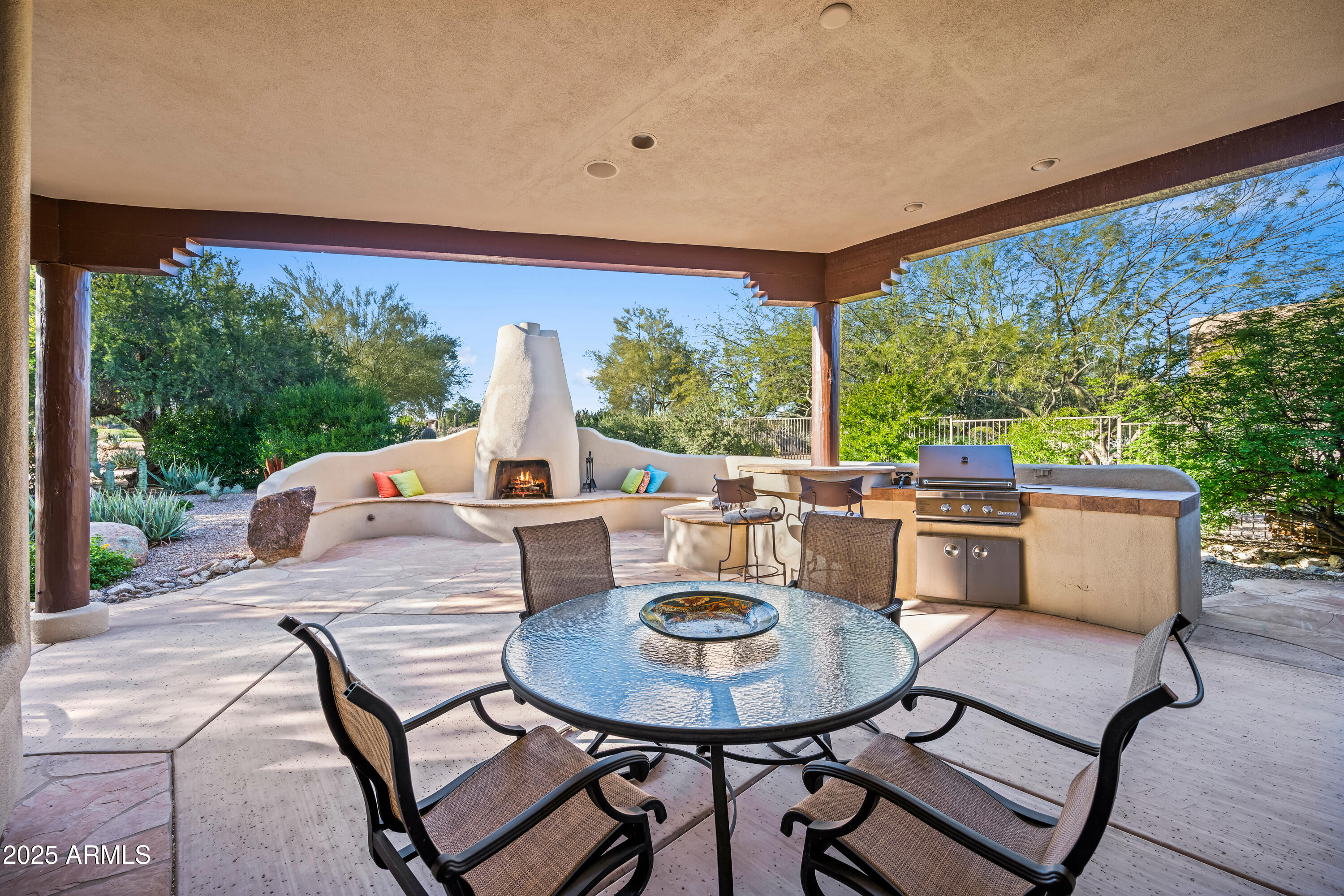 26708 North Aguila Road Rio Verde, AZ 85263 - Photo 35 of 46 a view of a patio with a table and chairs