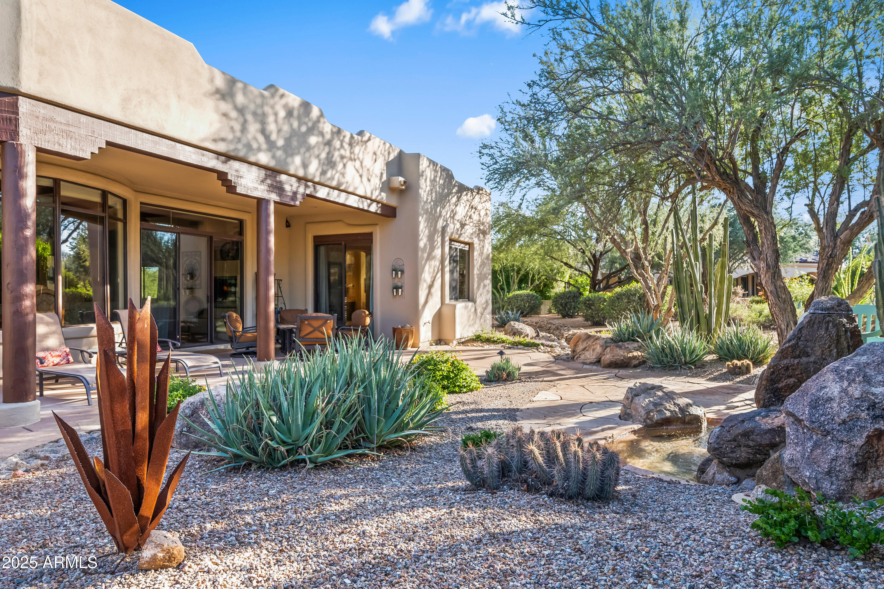 26708 North Aguila Road Rio Verde, AZ 85263 - Photo 42 of 46 a view of a house with backyard porch and sitting area
