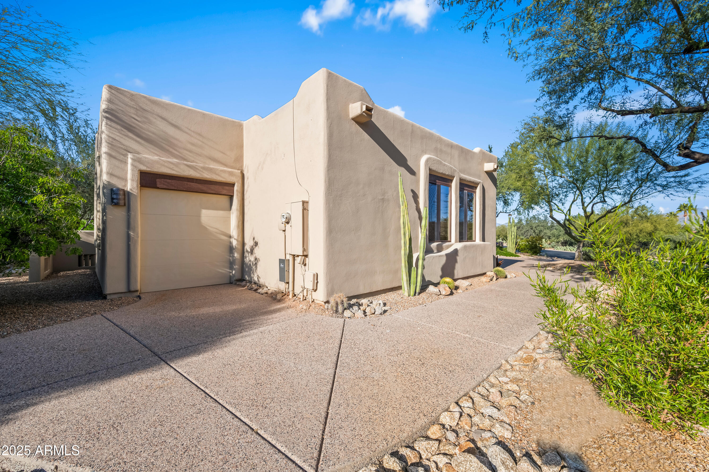 26708 North Aguila Road Rio Verde, AZ 85263 - Photo 46 of 46 a backyard of a house with yard and outdoor seating