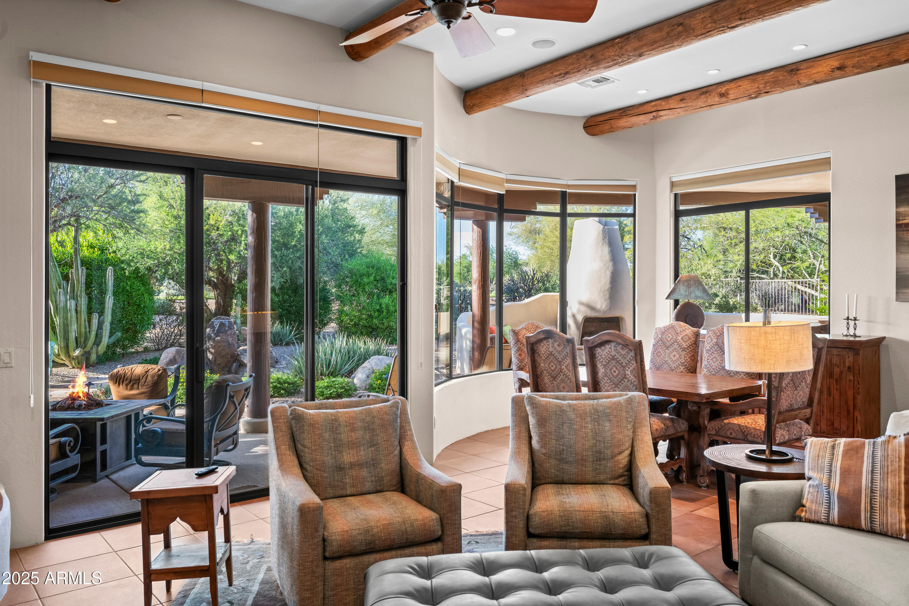 26708 North Aguila Road Rio Verde, AZ 85263 - Photo 9 of 46 a dining room with furniture a chandelier and glass door