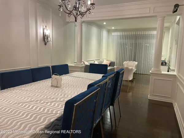 a dining room with furniture and wooden floor