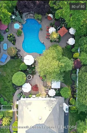 a view of bathroom with a sink and many chairs