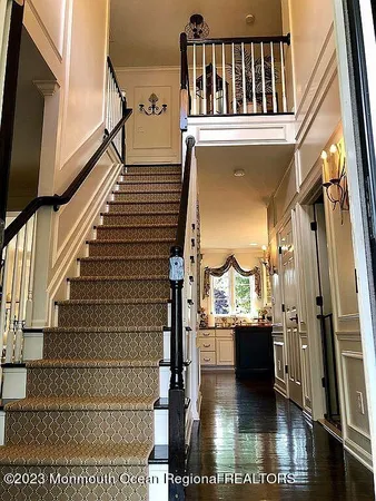 a view of a living room with a fireplace