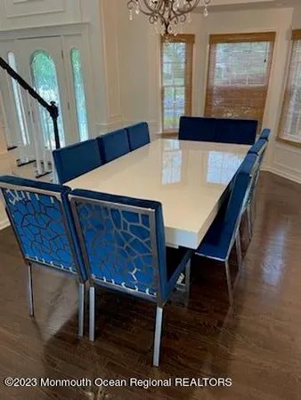 a view of a chairs and table in the room