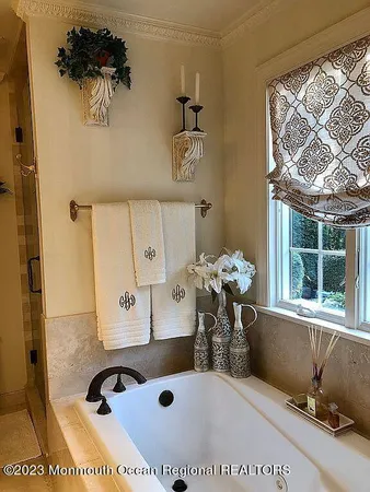 a view of kitchen with furniture and a chandelier