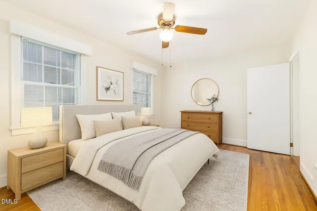 a bathroom with a granite countertop sink and a toilet