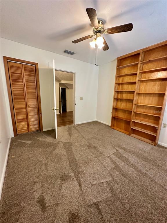 520 Southwest 5th Avenue Lake Butler, FL 32054 - Photo 12 of 54 a view of an empty room with a ceiling fan