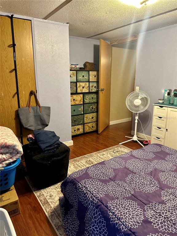 520 Southwest 5th Avenue Lake Butler, FL 32054 - Photo 41 of 54 a bedroom with a bed and wooden floor