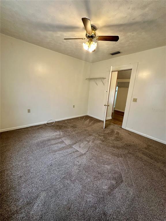 520 Southwest 5th Avenue Lake Butler, FL 32054 - Photo 6 of 54 an empty room with staircase and mirror