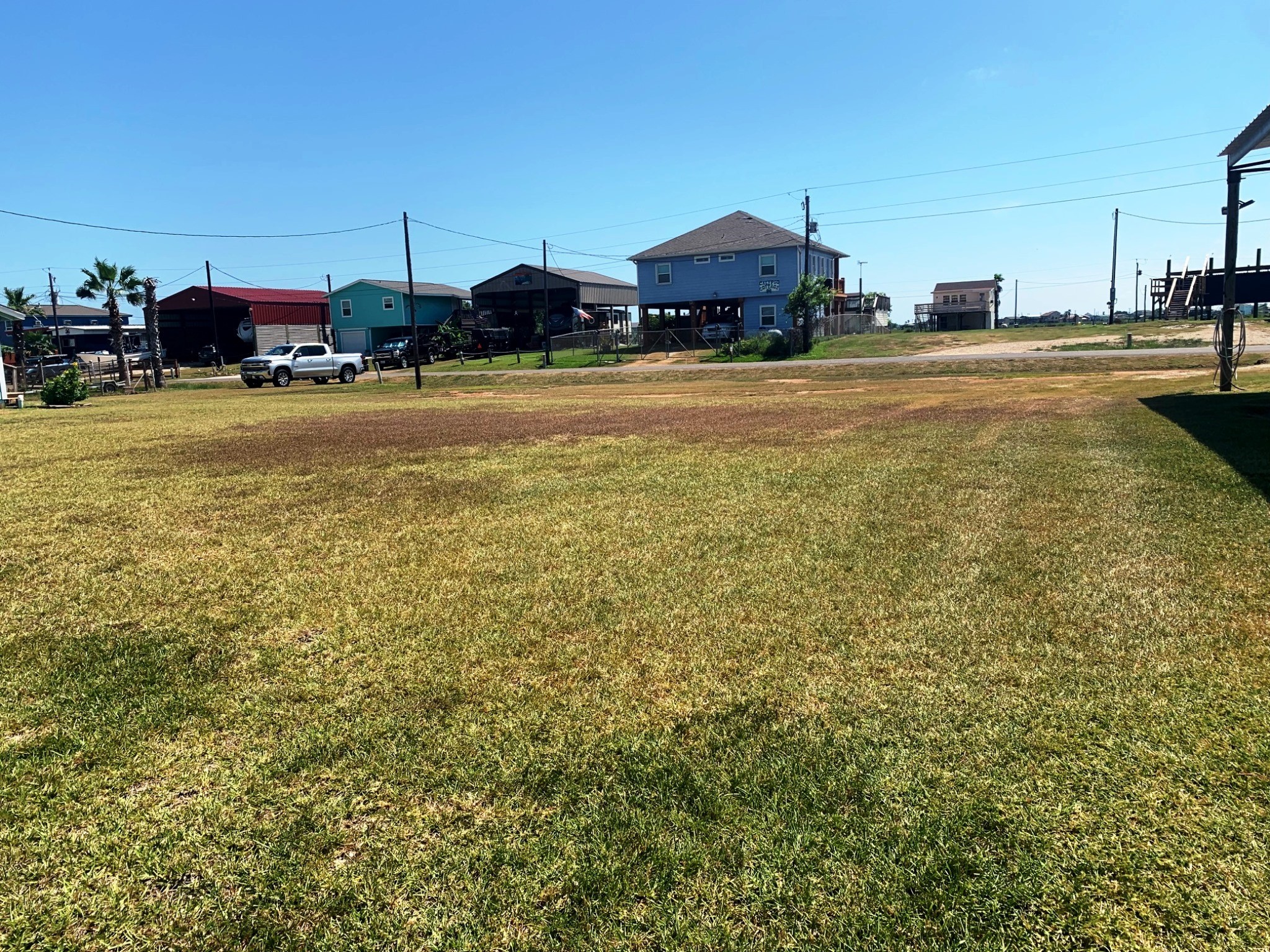 2331 Gulfview Drive Sargent, TX 77414 - Photo 2 of 5 a view of a street with cars parked
