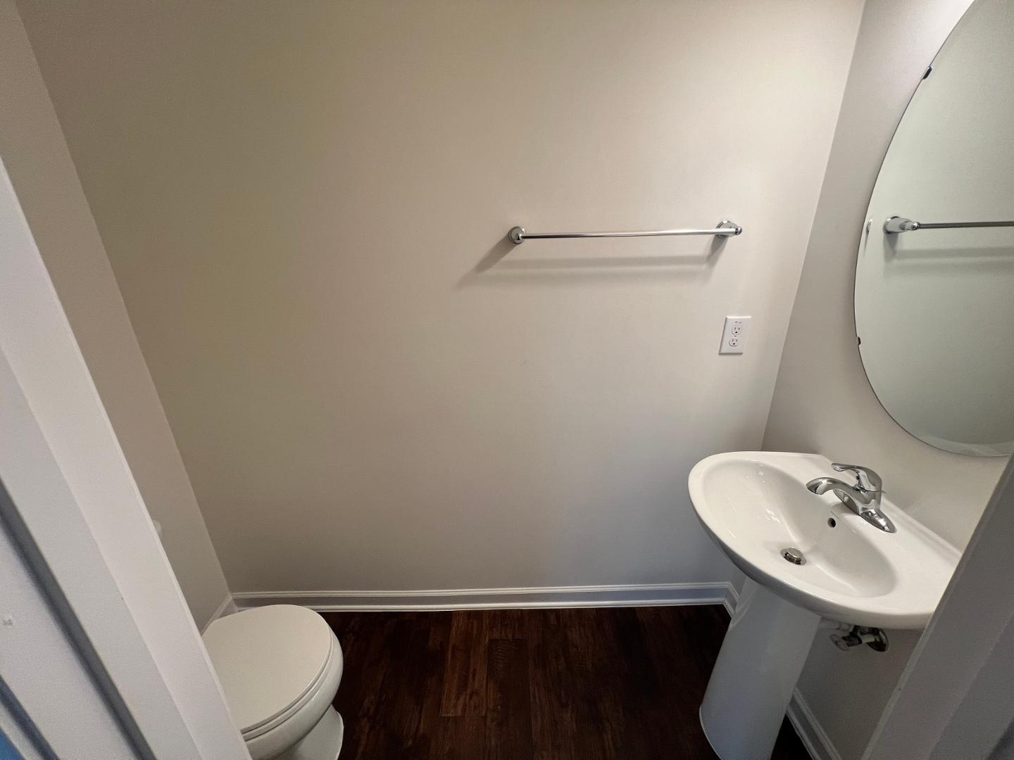 219 Cross Blossom Road Durham, NC 27703 - Photo 14 of 35 a bathroom with a sink a toilet and a mirror